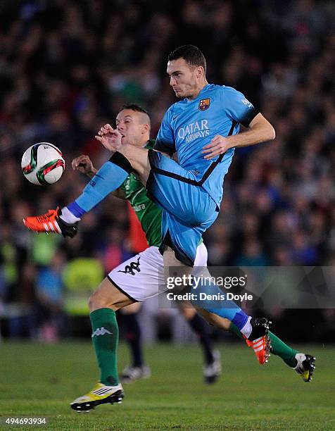 Thomas Vermaelen of FC Barcelona clears the ball from Casi Ruiz of C.F. Villanovense during the Copa del Rey Last of 16 First Leg match between C.F....