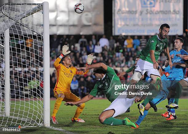 Jordi Masip of FC Barcelona keeps his eye on a high ball during the Copa del Rey Last of 16 First Leg match between C.F. Villanovense and F.C....