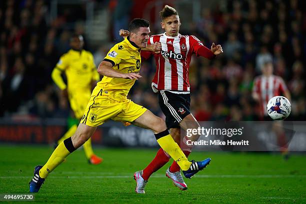 Ciaran Clark of Aston Villa challenges Gaston Ramirez of Southampton during the Capital One Cup Fourth Round match between Southampton v Aston Villa...