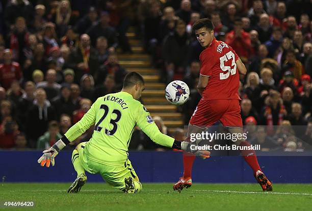 Joao Carlos Teixeira of Liverpool backheels past Adam Federici of Bournemouth during the Capital One Cup Fourth Round match between Liverpool and AFC...