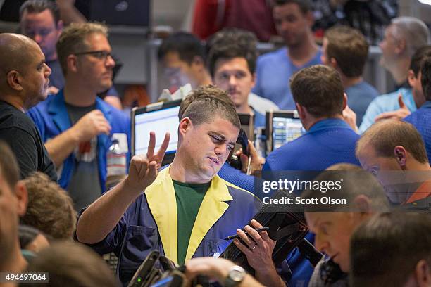 Traders in the Standard & Poor's 500 stock index options pit at the Chicago Board Options Exchange fill orders shortly before the close of trading on...