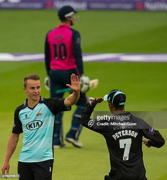 Tom Curran of Surrey celebrates taking the wicket of Joe Denly of Middlesex during the Surrey v Middlesex Panthers NatWest T20 Blast match at the Kia...