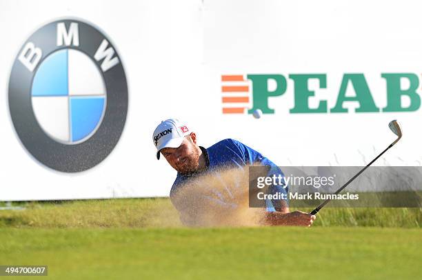 Shane Lowry of Ireland plays a bunker shot at the 18th green during the Nordea Masters at the PGA Sweden National on May 30, 2014 in Malmo, Sweden.