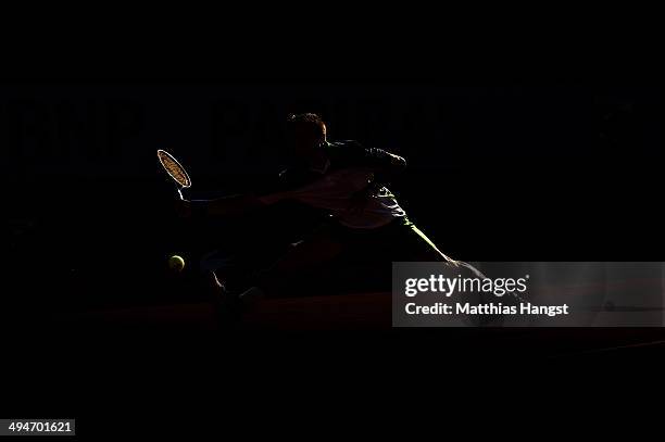 Tommy Robredo of Spain returns a shot during his men's singles match against John Isner of the United States on day six of the French Open at Roland...