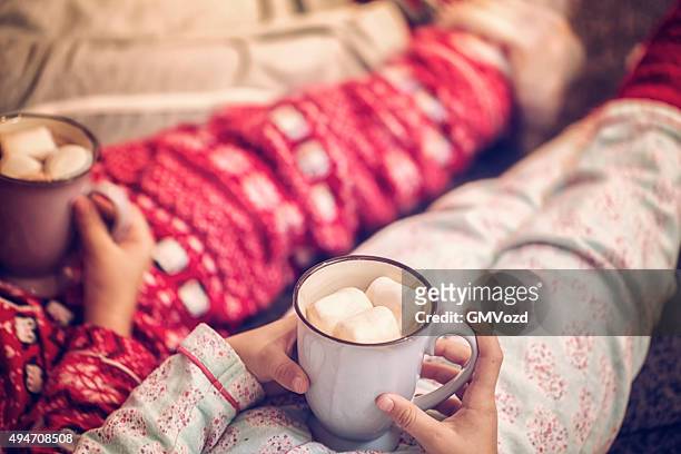 little kids drinking hot chocolate for christmas time - marshmallow stock pictures, royalty-free photos & images