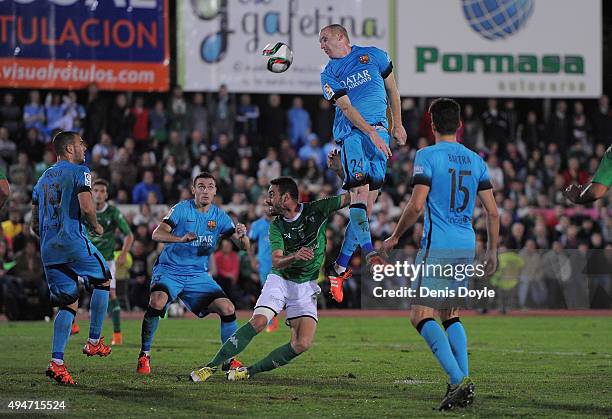 Jeremy Mathieu of FC Barcelona heads the ball during of the Copa del Rey Last of 16 First Leg match between C.F. Villanovense and F.C. Barcelona at...