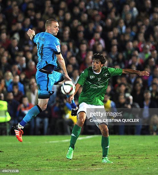 Barcelona's French defender Jeremy Mathieu vies with Villanovense's midfielder Curro during the Spanish Copa del Rey Round of 32 first leg football...