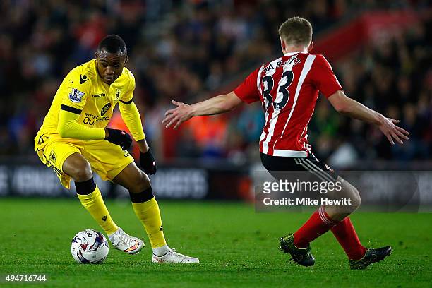 Jordan Ayew of Aston Villa gets past Matt Targett of Southampton during the Capital One Cup Fourth Round match between Southampton v Aston Villa at...