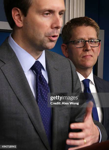 Deputy White House Press Secretary Josh Earnest speaks as Jay Carney listens during the White House daily briefing 2014 in the James Brady Press...