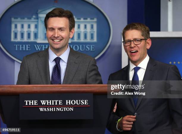 White House Press Secretary Jay Carney and Press Secretary Josh Earnest speak to members of the media during the White House daily briefing 2014 in...