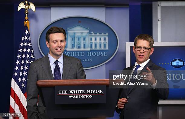 White House Press Secretary Jay Carney and Press Secretary Josh Earnest speak to members of the media during the White House daily briefing 2014 in...