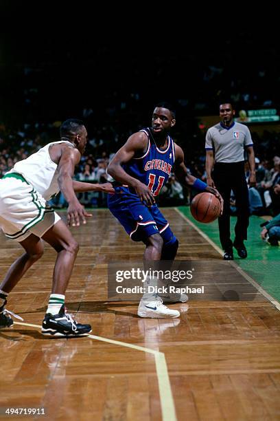 Terrell Brandon of the Cleveland Cavaliers handles the ball against Dee Brown of the Cleveland Cavaliers during a game played in 1992 at the Boston...