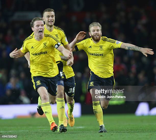 Grant Leadbitter, Ben Gibson and Adam Clayton of Middlesbrough celebrate after the Capital One Cup Fourth Round match between Manchester United and...