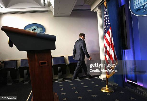 White House Press Secretary Jay Carney leaves the James Brady Press Briefing Room of the White House after U.S. President Barack Obama announced the...