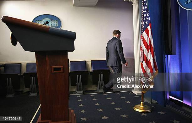 White House Press Secretary Jay Carney leaves the James Brady Press Briefing Room of the White House after U.S. President Barack Obama announced the...