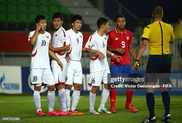 Choe Song Hyok, Yon Jun Hyok, Han Kwang Song and Kim Ye Bom of Korea DPR and Andy Reyes of Costa Rica line up in front of the Korea DPR net prior to...