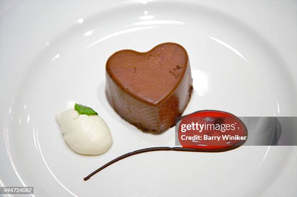 heart-shaped chocolate and red syrup - whip cream dollop stock pictures, royalty-free photos & images