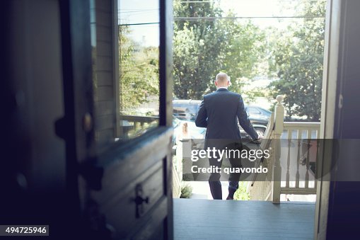 Man Rushing Out A Door Guy Running Out The Front Door High-Res Stock Photo - Getty Images