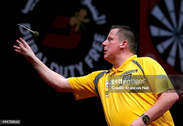 Dave Chisnall of England plays against Peter Wright of England during the 2014 Dubai Duty Free Darts Masters Semi-Final match at Dubai Duty Free...
