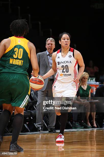 Kara Lawson of the Washington Mystics drives to the basket against the Seattle Storm at the Verizon Center on May 24, 2014 in Washington, DC. NOTE TO...