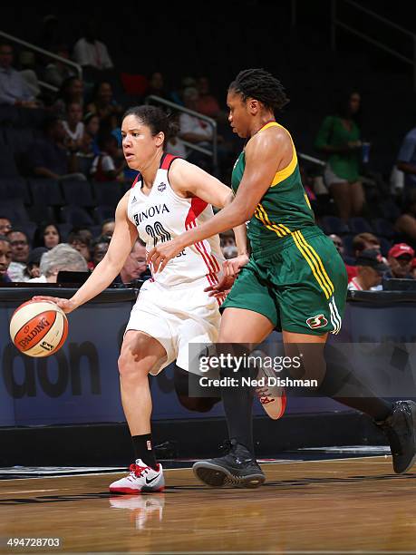 Kara Lawson of the Washington Mystics dribbles the ball against the Seattle Storm at the Verizon Center on May 24, 2014 in Washington, DC. NOTE TO...