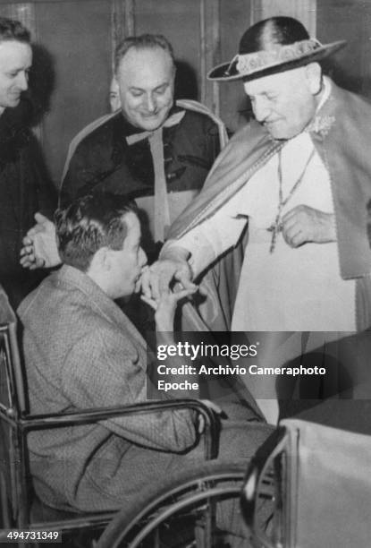 Giovanni XXIII whose birthday has been celebrated yesterday is homaged by a poliomyelitis patient Nov 25 1958.