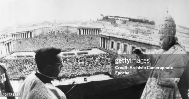 Giovanni XXIII blesses the huge crowd from the lateral balcony of the Vatican Basilica April 22 1962.