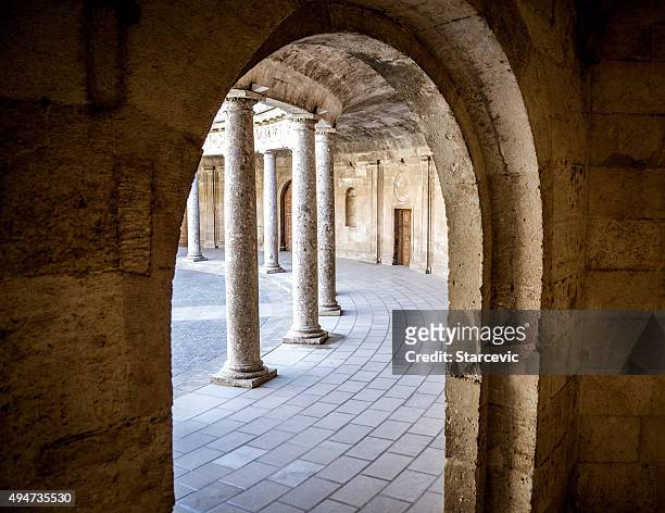 courtyard in the alhambra - doric arches stock pictures, royalty-free photos & images