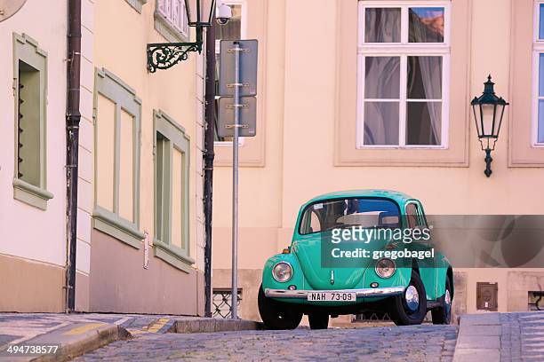 volkswagen beetle on streets of prague, czech republic - beetle stockfoto's en -beelden