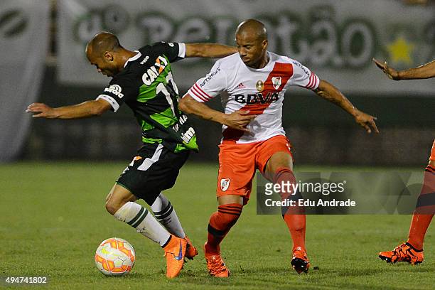 Andres Sanchez of River Plate fights for the ball with Ananias of Chapecoense during a match between Chapecoense and River Plate as part of Quarter...