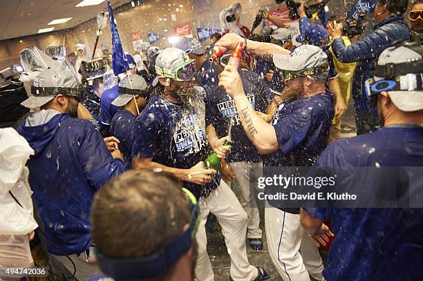 PLayoffs: Kansas City Royals players victorious in locker room after winning Game 6 and series vs Toronto Blue Jays at Kauffman Stadium. Kansas City,...