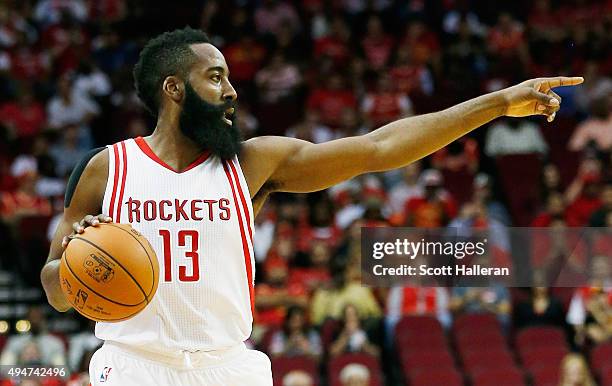 James Harden of the Houston Rockets calls a play during their game against the Denver Nuggets at the Toyota Center on October 28, 2015 in Houston,...