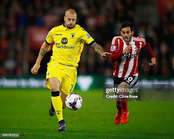 Alan Hutton of Aston Villa is closed down by Juanmi of Southampton during the Capital One Cup Fourth Round match between Southampton and Aston Villa...