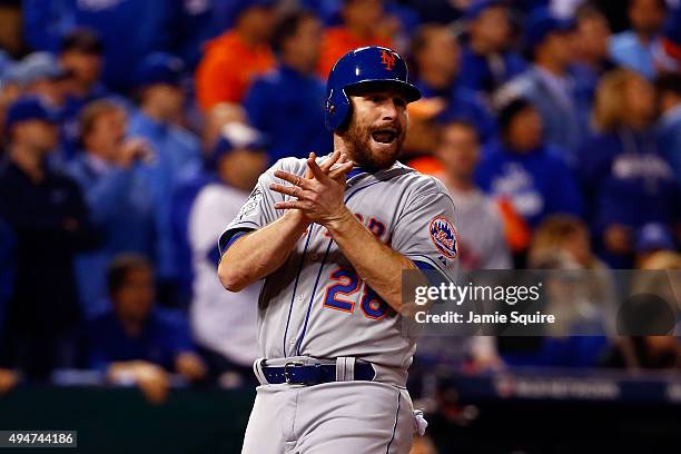 Daniel Murphy of the New York Mets celebrates scoring a run on an RBI single hit by Lucas Duda of the New York Mets in the fourth inning against the...