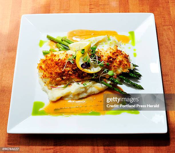 Baked Haddock with buttery crumbs and lobster veloute sauce with potato puree and asparagus at Dockside Grill in Falmouth Foreside for Dine Out Maine.