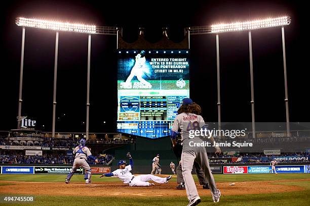 Alcides Escobar of the Kansas City Royals scores a run on a two-run RBI single hit by Eric Hosmer of the Kansas City Royals in the fifth inning...