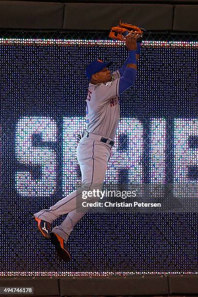 Yoenis Cespedes of the New York Mets catches a ball hit by Alex Rios of the Kansas City Royals at the wall in the sixth inning in Game Two of the...