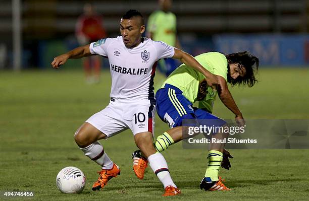 Jorge Cazulo of Sporting Cristal vies for the ball with Joel Sanchez of San Martin during a match between San Martin and Sporting Cristal as part of...