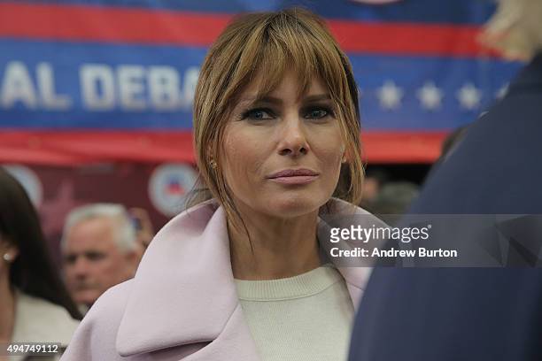 Melania Trump, wife of presidential candidate Donald Trump, listens to her husband speak to the media in the spin room after the CNBC Republican...