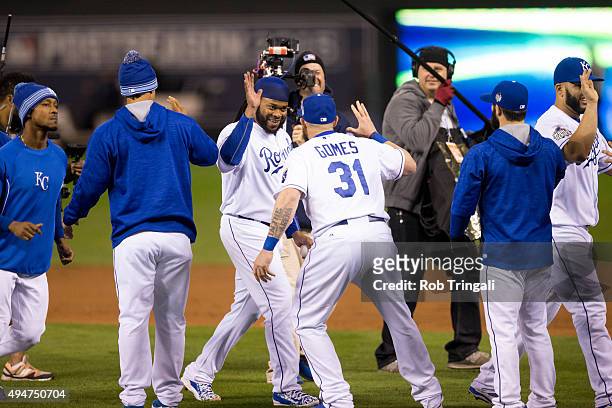 Johnny Cueto and Jonny Gomes of the Kansas City Royals celebrate defeating the New York Mets in Game 2 of the 2015 World Series at Kauffman Stadium...
