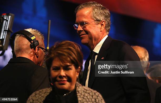 Presidential candidate Jeb Bush walks off stage with his wife Columba after the CNBC Republican Presidential Debate at University of Colorados Coors...