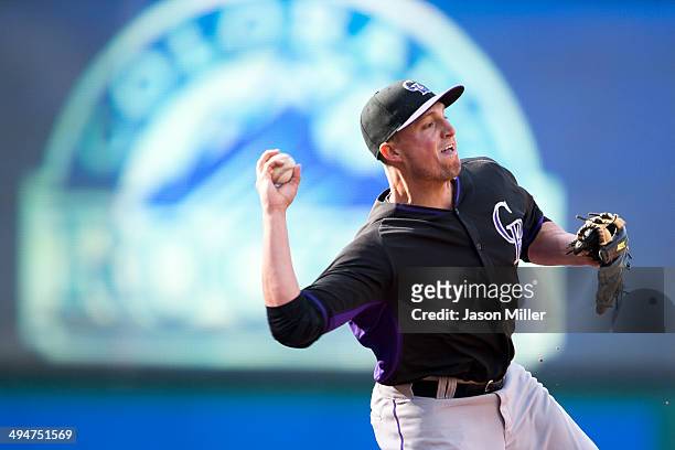 Jordan Pacheco of the Colorado Rockies warms up prior to the game against the Cleveland Indians at Progressive Field on May 30, 2014 in Cleveland,...