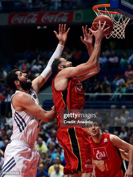 Nikola Mirotic of Real Madrid in action with Viktor Sanikidze of CAI Zaragoza during the playoff match for Liga Endesa in Madrid, Spain on May 30,...