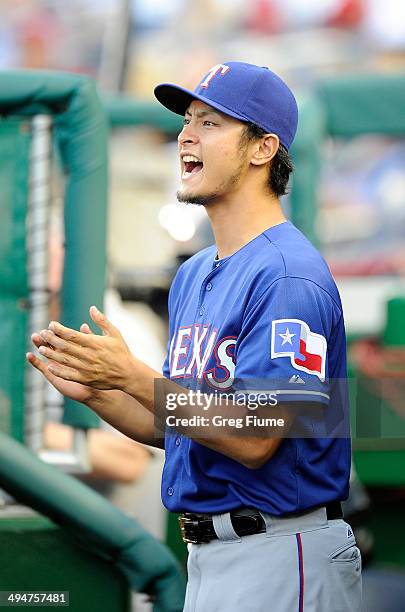 Yu Darvish of the Texas Rangers celebrates as Texas scores in the second inning against the Washington Nationals at Nationals Park on May 30, 2014 in...