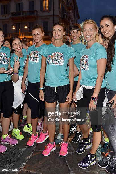 Fiammetta Cicogna, Martina Colombari and Federica Fontana compete in We Own The Night - Milan Women's 10km Run on May 30, 2014 in Milan, Italy.