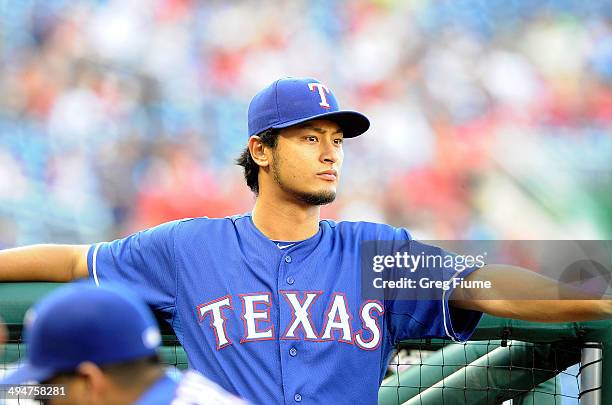 Yu Darvish of the Texas Rangers stands in the dugout before the game against the Washington Nationals at Nationals Park on May 30, 2014 in...