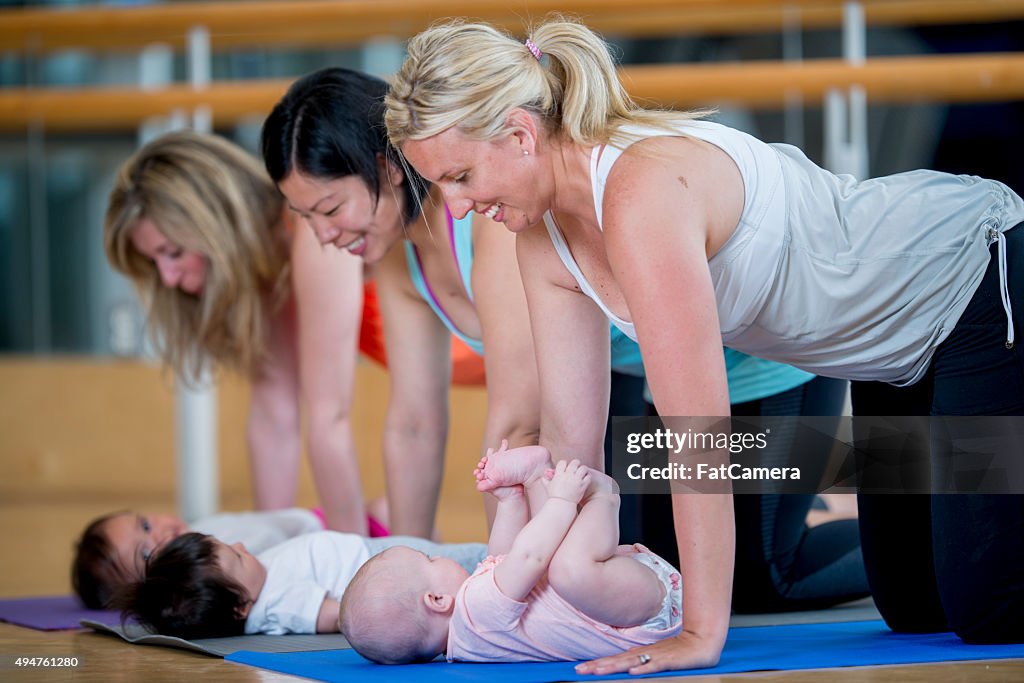 Moms Doing a Baby Yoga Class