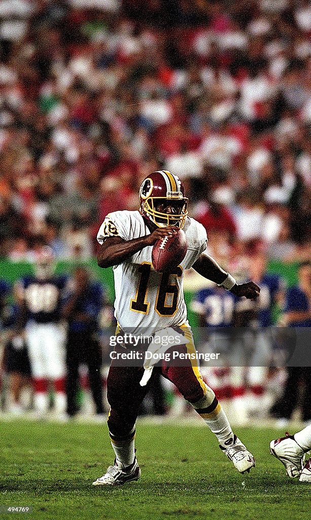 Rodney Peete of the Washington Redskins runs with the ball during a
