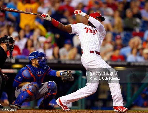 Domonic Brown of the Philadelphia Phillies hits a three run home run against the New York Mets during the fourth inning in a game at Citizens Bank...