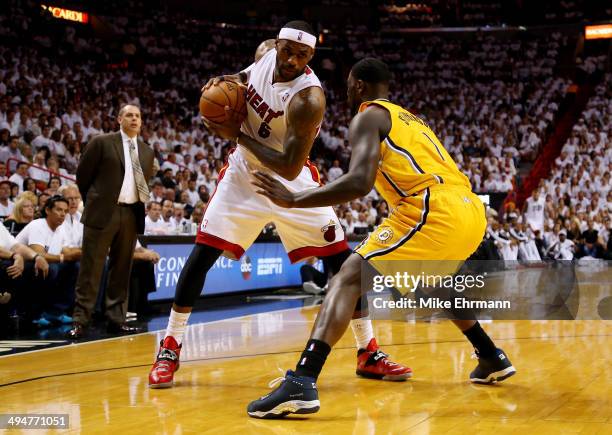 LeBron James of the Miami Heat controls the ball as Lance Stephenson of the Indiana Pacers defends during Game Six of the Eastern Conference Finals...